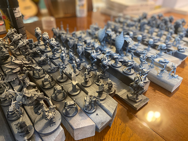 Nights Around a Table - every mini in my board game collection primed white - zenithal priming
