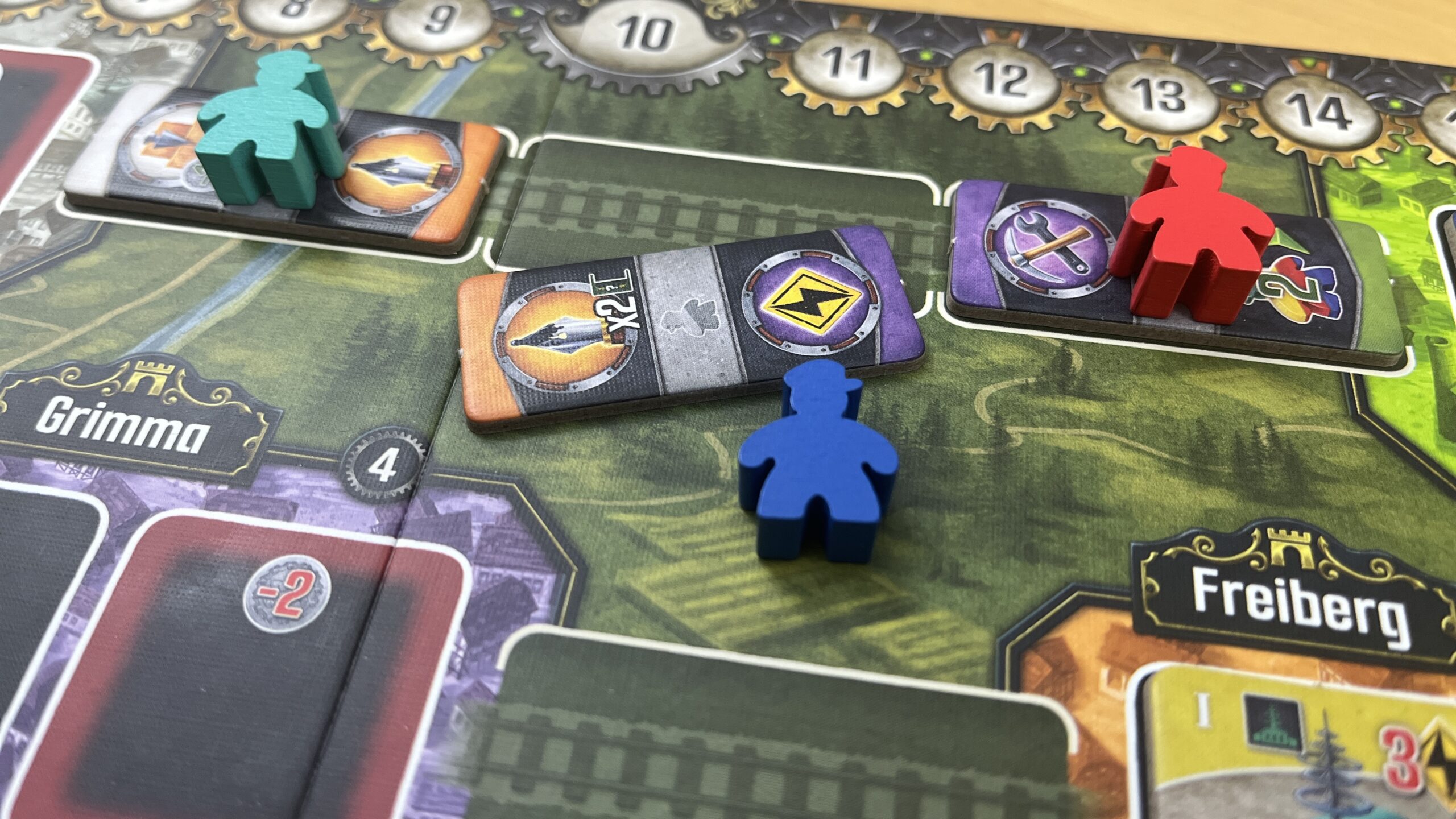 Nights Around a Table - Nucleum board game completing a railroad track